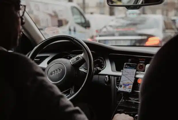 man in black jacket driving car during daytime